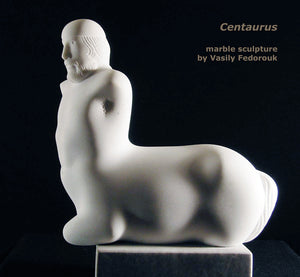 Profile view of beautiful male centaur carved from white marble with sensuous curves.  Artwork by Vasily Fedorouk
