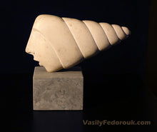 Laden Sie das Bild in den Galerie-Viewer, Marble sculpture of a face with seashell hair in profile on a dark background with 'VasilyFedorouk.com' branding.
