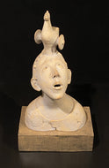 Ceramic bust with unique headpiece of a Trojan horse on a black background