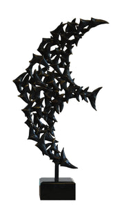 Bronze sculpture made up of many small birds that form the shape of the larger flying bird with wings spread. Bronze sculpture shown on white background