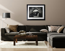 Cargar imagen en el visor de la galería, Neutral living room scene with framed art drawing of man on motorcycle hanging on wall over dark grey couch and a Zebra striped stone sculpture of lips on coffee table.  Both artworks by Kelly Borsheim
