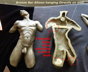 This images shows the pre-drilled threaded holes in the back of the male nude figure Valentine to mount to stone, as well as the solid bronze bar that allows you to hang the torse directly on the wall without any base... a very different effect in your home decor!