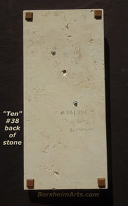 #38 in the edition, back side that shows the travertine base, the edition number, artist name in pencil, the screws that affix the bronze to the stone, as well as the hanging hole in the upper center.  Note the rubber bumpers in each corner.  Original art by Kelly Borsheim