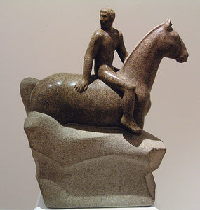 In this original stone carving (in granite), a man turns to look behind him as he sits on top of a horse.  Beautiful sculpture by Vasily Fedorouk