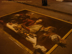 Street artists, including Kelly Borsheim, worked to paint this copy of a Caravaggio painting, Via Calimala Florence, Italy street art