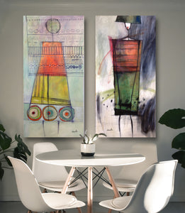 Abstract figure paintings inspired by fashion models, the large oil paintingsAthena and Demetra pair together beautifully in this modern dining room