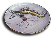 Laden Sie das Bild in den Galerie-Viewer, Miss Mushroom This fantasy drawing printed onto a porcelain and gold plate features the high-heeled shoe of Miss Mushroom (see top of shoe) and she is sure to delight!  Do you see red lips with tails, a serpent or snake, butterfly wings, zebra stripes, leopard design, tiny shoes, a bouquet of flowers, especially daisies, bats, and a spider web?
