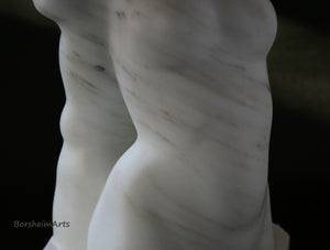 gorgeous detail in these diagonal grey or silver streaks in the Colorado Yule Marble figure sculpture by Kelly Borsheim, Detail of mineral streaks in the Colorado Yule Marble