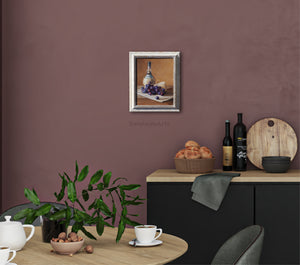 wine bottle painting with a cluster of red / purple grapes, Parmesan cheese look great in this burgundy wall color kitchen.
