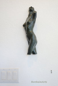 Enhancing your smaller walls, this nude female torso is a ballerina sculpture by artist Kelly Borsheim