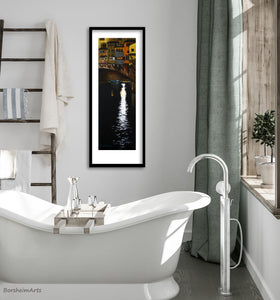 print of pastel drawing on black paper of the famous Ponte Vecchio in Florence, Italy, night drawing of bridge over river looks great in this modern bathroom with elegant bathtub and natural light.