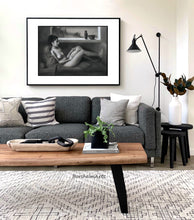 Cargar imagen en el visor de la galería, Alternative frame idea; Horizontal black and white charcoal drawing of a seated nude figure looks great over the grey couch in this living room scene... neutral home decor is relaxing.
