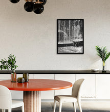 Load image into Gallery viewer, This dining room with touches of deep orange and black countertops is enhanced by print of charcoal drawing of public water fountain in Milano, Italia, shown here, art by artist Kelly Borsheim
