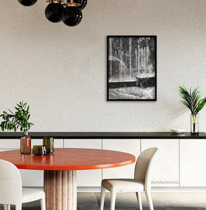 This dining room with touches of deep orange and black countertops is enhanced by print of charcoal drawing of public water fountain in Milano, Italia, shown here, art by artist Kelly Borsheim