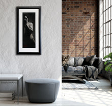 Load image into Gallery viewer, This tall narrow black and white figure drawing of a man with his hands over his face looks great in a modern loft apartment with grey furniture and nearby a red brick wall.  Original framed art by Kelly Borsheim

