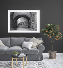 Load image into Gallery viewer, sample frame with mat in a room Charcoal drawing with some pastel:  A ghostly figure in the traditional Venetian black hat and cape, called the &#39;Tabarro&#39; in Italian, approaches the Ponte Canal [canal bridge] in Venezia (Venice, Italy)
