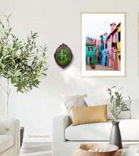Load image into Gallery viewer, Mix and match types of art and images to make your home your happy place.  Shown here is a living room with the small oval botanical painting next to a larger photographic print of laundry hanging on the island of Burano, Italy... both by artist Kelly Borsheim
