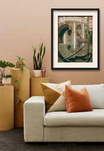 Load image into Gallery viewer, This original drawing of the carousel (La Giostra in Italian) looks great in this warm neutral colored living room. An eye-catching pastel drawing on brown paper features a moon shaped riding car and a carousel horse. living room scene
