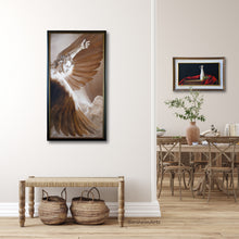 Load image into Gallery viewer, Shown here in an entryway leading to the dining room is the framed giclee print of The Triumph of Icarus is painting that sold in 2004.  It depicts the moment when Icarus is at his highest point in Flight, above the clouds and looking down, surrounded by his wings, in a moment of pure joy and awe at his total freedom.  Just before his famous fall to his death. artwork by Kelly Borsheim
