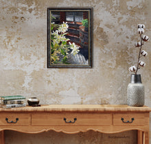 Load image into Gallery viewer, country living is enhanced with warm colors and this original painting of jasmine florals.  shown here above a side table and a vase of cottom blooms.
