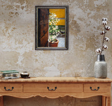 Laden Sie das Bild in den Galerie-Viewer, Shown here as an accent piece in a corridor, this original framed painting of keys to the house in the open door with a pot of jasmine flowers and a broken old bench in the background look great hanging on a warm light brown textured wall and over a side board.  There is a stem of cotton plant in a vase to the right.  Cottagecore decor, charming art for the rustic home
