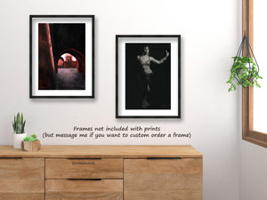 Paired framed pastel and charcoal drawings of Marrakesh and a female belly dancer... in a contemporary traveler's bedroom decor.