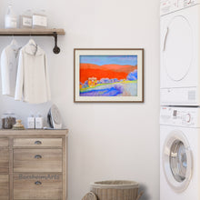 Load image into Gallery viewer, the original artwork Orange Tuscan Hills pastel painting is shown here in an example frame hanging on the wall of a neutral decor laundry room... adding a splash of color!
