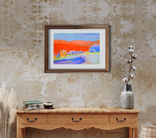 Charger l&#39;image dans la galerie, Orange Tuscan Hills pastel painting original shown in mockup of white mat and medium-toned wood frame, hung on an entryway wall over a side table of similar color wood.
