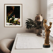 Load image into Gallery viewer, Framed print of Pinocchio as the world traveler graces and inspires in this home office.  Bronze sculpture &quot;Together and Alone&quot; is shown on the tabletop.
