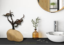 Load image into Gallery viewer, 16 inch tall sculpture of Sea Turtles swimming in kelp enhances this bathroom counter space.  Sculpture is a limited edition bronze and stone (each limestone base is hand carved).  3-d Art by Kelly Borsheim
