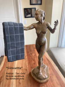Bronze figure with outstretched arm may serve as a small towel rack for your kitchen or bathroom