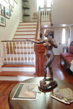 Laden Sie das Bild in den Galerie-Viewer, This image shows the bronze patina on the Sirenetta / Little Mermaid bronze figure sculpture displayed on a small round table in the entryway of a historical home.  Her outstretched arm seems like an invitation to come on in!
