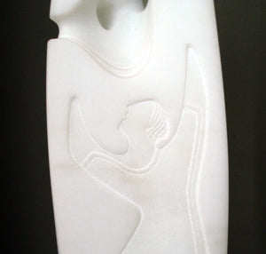 Rejoicing figure is a white on white bas relief in thsi marble carving by Vasily Fedorouk.  