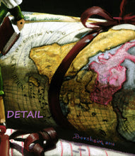 Laden Sie das Bild in den Galerie-Viewer, Another detail of the old world map rolled up with a burgundy ribbon wrapped around it.  Detail from the pastel drawing on black paper of Pinocchio as a world traveler.
