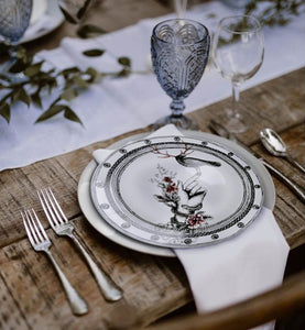 Add some personal style to your table with these designer plates from the Adamov Collection.  Bird on a hand design.  Buy individually or in numbers.