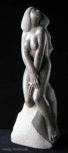 Stone Sculpture of a modest nude woman looking upwards towards the heavens. She is classical and elegant and looks lovely in a luxury home, or even a relatively modest one. Sculpture by Ukrainian artist Vasily Fedorouk
