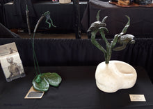 Load image into Gallery viewer, On exhibit in a sculpture show in Little Rock, Arkansas, you see two aquatic-themed bronze sculptures by Kelly Borsheim:  Cattails and Frog Legs    and Sea Turtles (a combination of bronze and stone)
