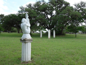 On exhibit in Sculpture Garden in Boerne Texas Garden Statue Gymnast Pike Position on Four Headed Turtle Fantasy Figure Statue Marble