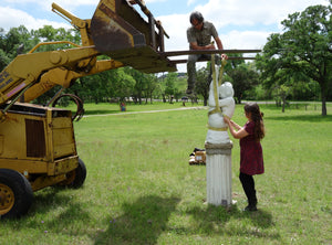 John and Kelly Borsheim use a forklift to remove Gymnast sculpture from exhibit in Boerne, Texas.  Garden Statue Gymnast Pike Position on Four Headed Turtle Fantasy Figure Statue Marble