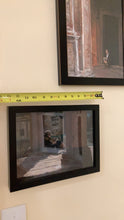Load image into Gallery viewer, Libri Riviste e Fumetti - girl reading small pastel painting hung on the wall.  A tape measure is shown above it to help you see the size.  Above is another framed artwork in pastels and charcoal by artist Kelly Borsheim titled &quot;Pensive in Bologna.&quot; 
