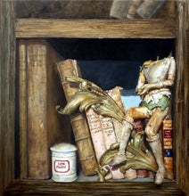 Laden Sie das Bild in den Galerie-Viewer, This still life depicts a headless puppet sitting on a group of old books on a wooden bookshelf. There is a small white ceramic jar with some elixir inside and a decorative wood leaf arranged there.  The artist has signed her name as if it is the title on one of the larger old books
