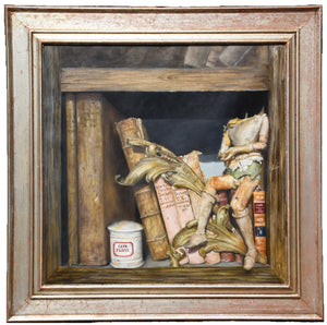 another view of the still life painting of old books and headless wooden antique doll sitting on a shelf of oil paint... lovely frame wth red highlights in the distressed platinum finish 