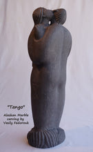 Cargar imagen en el visor de la galería, Tango a 2-foot tall stone carving in Alaskan marble of a closely dancing couple.  As he embraces her, she nibbles on his ear.  The figures are modern, abstracted or better, designed with minalist features and intertwined fingers.  A romantic sculpture, carved by Ukrainian-American artist and sculptor Vasily Fedorouk.  Vertical, standing figures.
