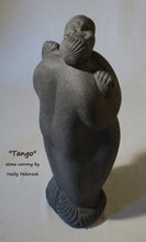 Cargar imagen en el visor de la galería, Tango a 2-foot tall stone carving in Alaskan marble of a closely dancing couple.  As he embraces her, she nibbles on his ear.  The figures are modern, abstracted or better, designed with minalist features and intertwined fingers.  A romantic sculpture, carved by Ukrainian-American artist and sculptor Vasily Fedorouk.  Vertical, standing figures.
