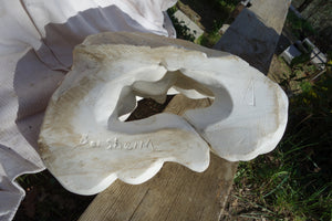 View of the bottom of the sculpture with artist's signature Borsheim, the crack that separates the hair curves in front, and on the right, the artist's logo. Serentiy marble art