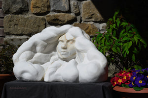 Marble sculpture portrait of a serene woman with flowing locks of wavy hair Serenity marble art