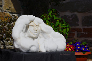 Marble sculpture portrait of a serene woman with flowing locks of wavy hair Serenity marble art