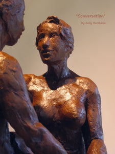 Detail of impressionist woman's face as she looks up and listens to her partner speaking.  Ceramic sculpture detail