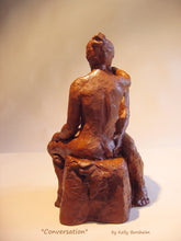 Carica l&#39;immagine nel visualizzatore di Gallery, View of the woman&#39;s back.  Her hair is in a loose bun, not draped over her anatomy. Conversation, a ceramic sculpture of a man and woman having a heart to heart discussion. Great romantic gift of original art
