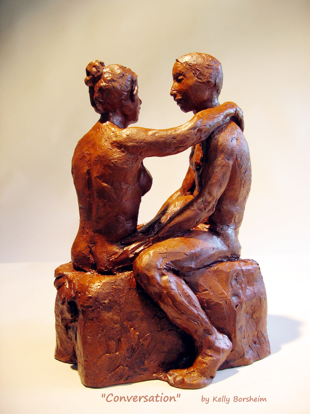 Conversation, a ceramic sculpture of a man and woman having a heart to heart discussion. Great romantic gift of original art